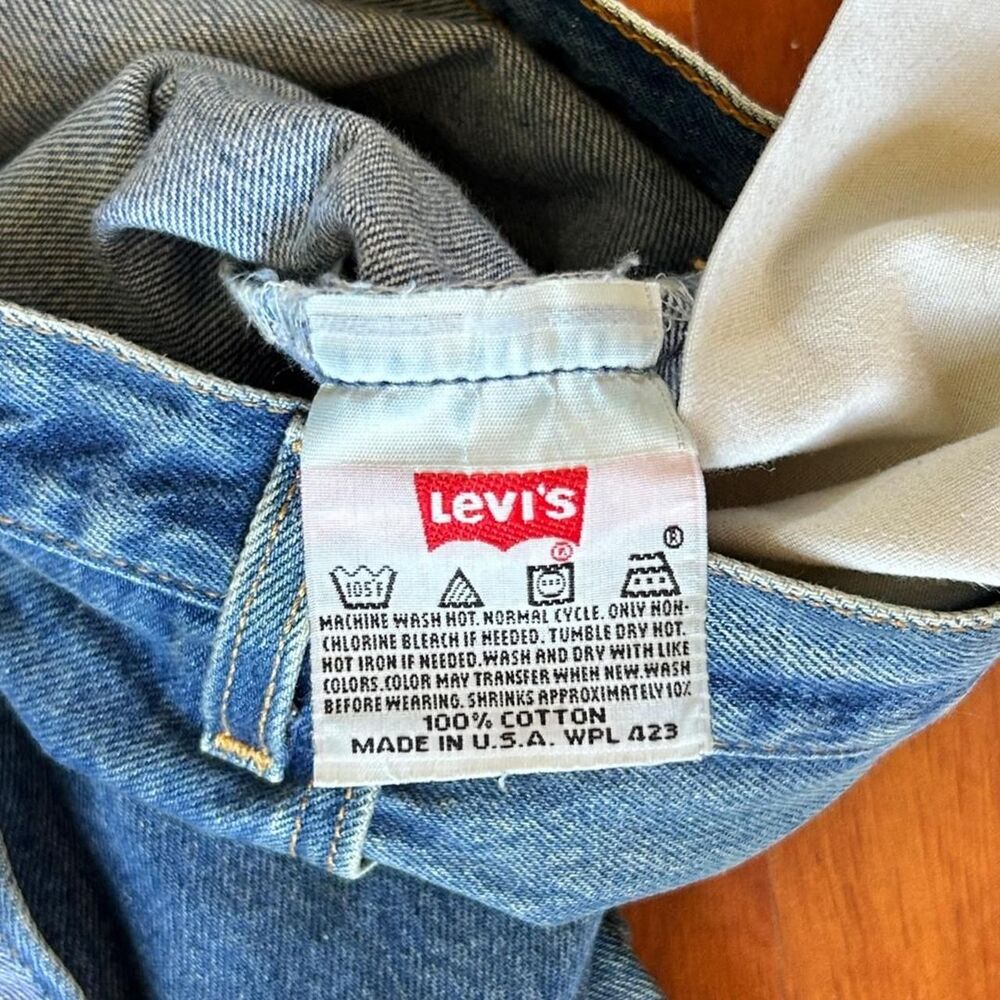 Levis 501 Made in USA vintage 90s faded and distressed jeans